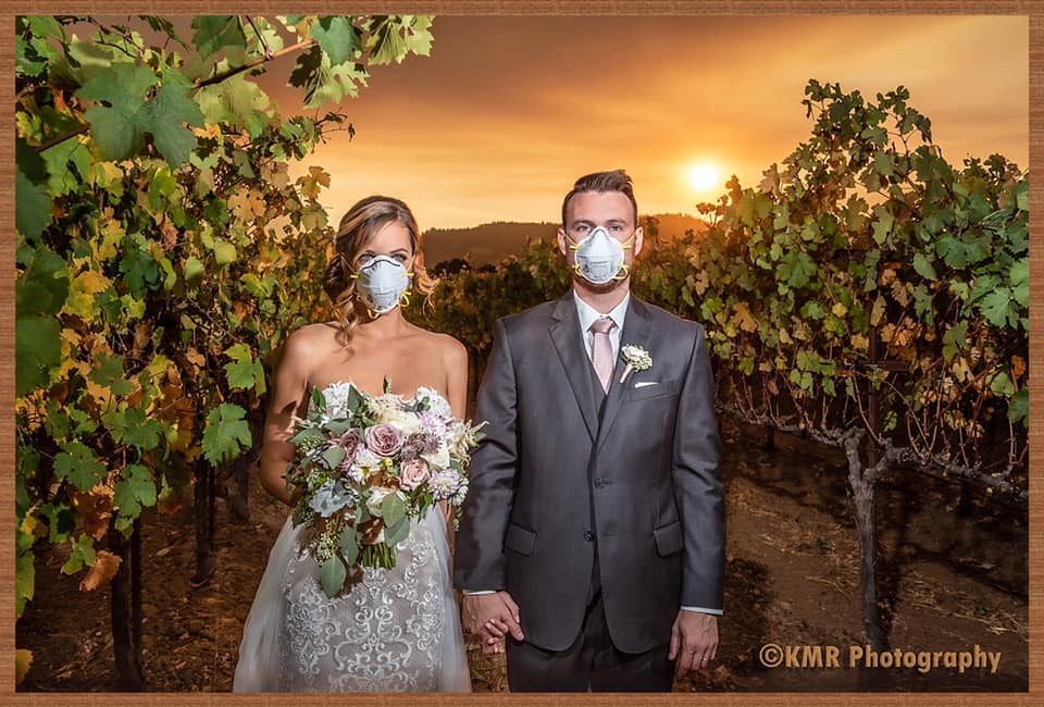 Newlyweds don protective masks for wedding photo amid wildfire