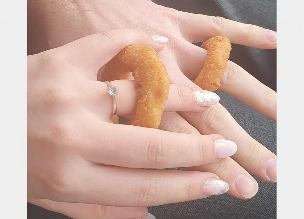 Couple exchange onion rings after cancelled wedding